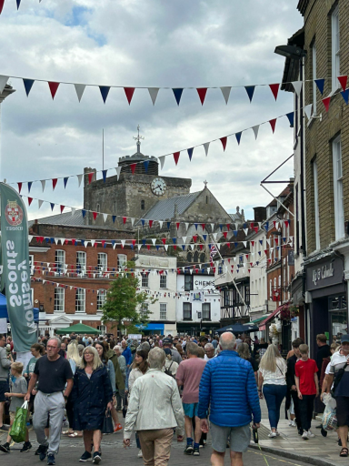 Crowded streets with people enjoying the music and the atmosphere.